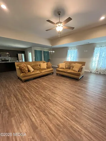 a bathroom with a double vanity sink toilet and shower