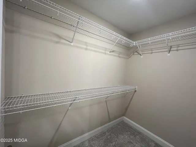 a kitchen with stainless steel appliances granite countertop a stove and a microwave