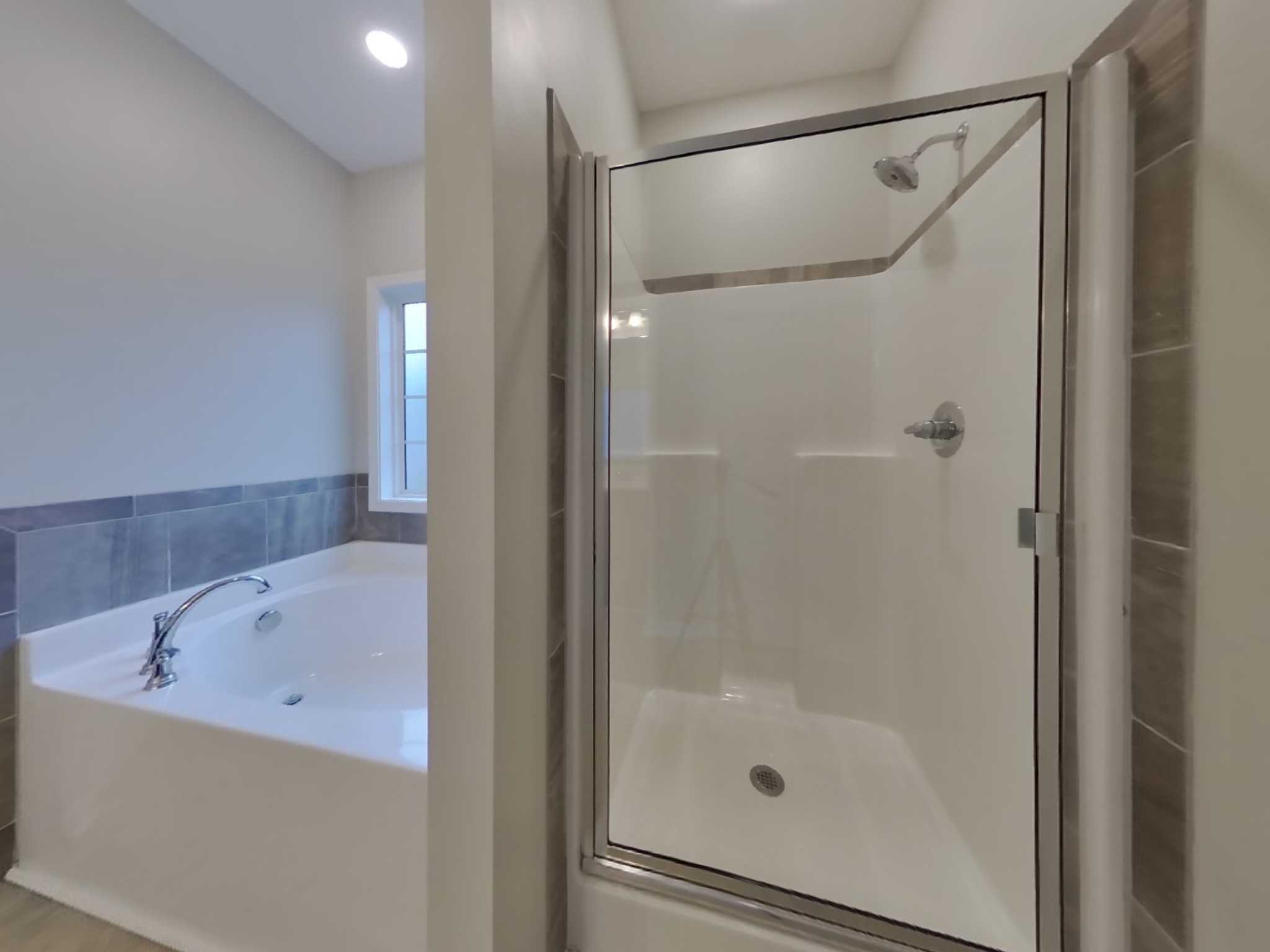 824 Ellyson Drive Spring Hill, TN 37174 - Photo 11 of 18 a bathroom with a bathtub and a shower