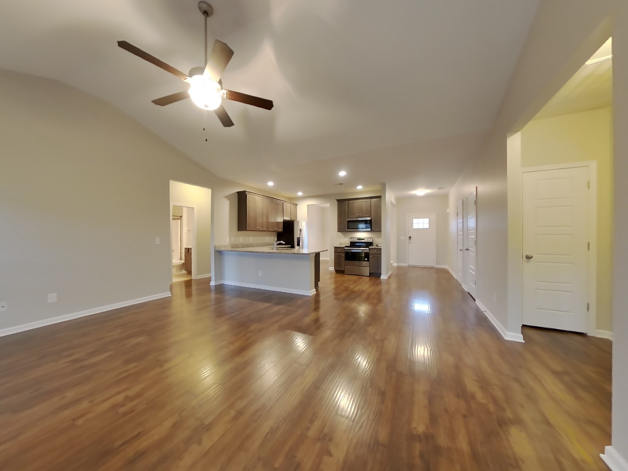 824 Ellyson Drive Spring Hill, TN 37174 - Photo 3 of 18 a view of kitchen and hall with wooden floor