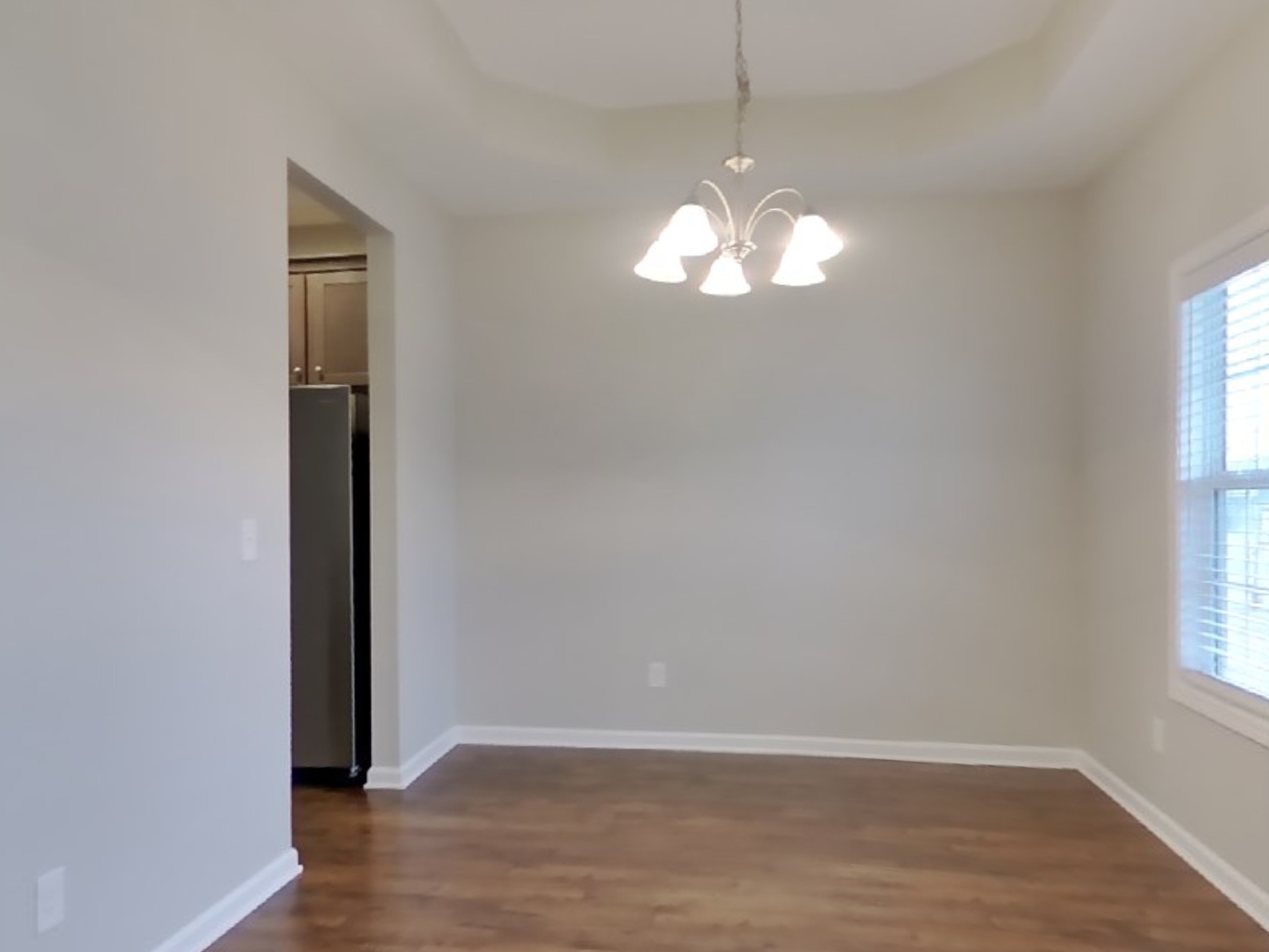 824 Ellyson Drive Spring Hill, TN 37174 - Photo 5 of 18 an empty room with wooden floor and windows