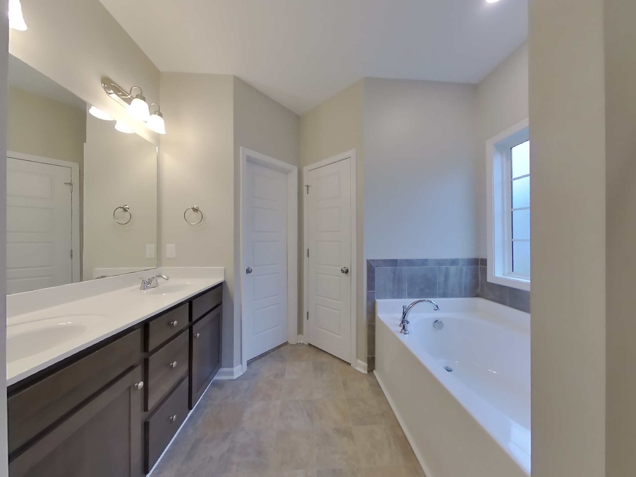824 Ellyson Drive Spring Hill, TN 37174 - Photo 10 of 18 a bathroom with a bathtub and a sink