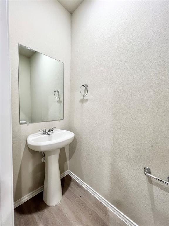 3501 East Renfro Street, Unit 611 Burleson, TX 76028 - Photo 13 of 35 a bathroom with a sink a toilet and mirror