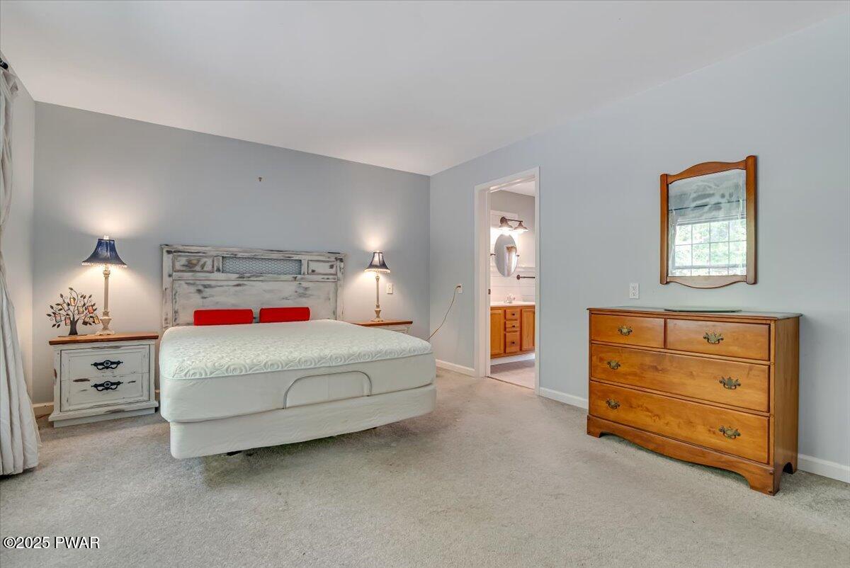 42 Beaver Pond Road Lake Ariel, PA 18436 - Photo 17 of 77 a bedroom with a bed and a night stand