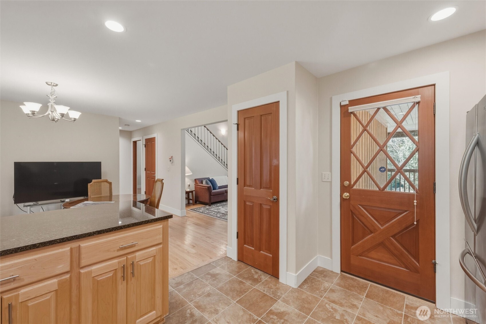 16059 Snee Oosh Road La Conner, WA 98257 - Photo 15 of 40 a hallway with a couch and a flat screen tv