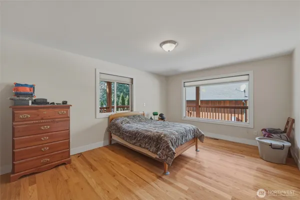 a bedroom with a bed and a dresser