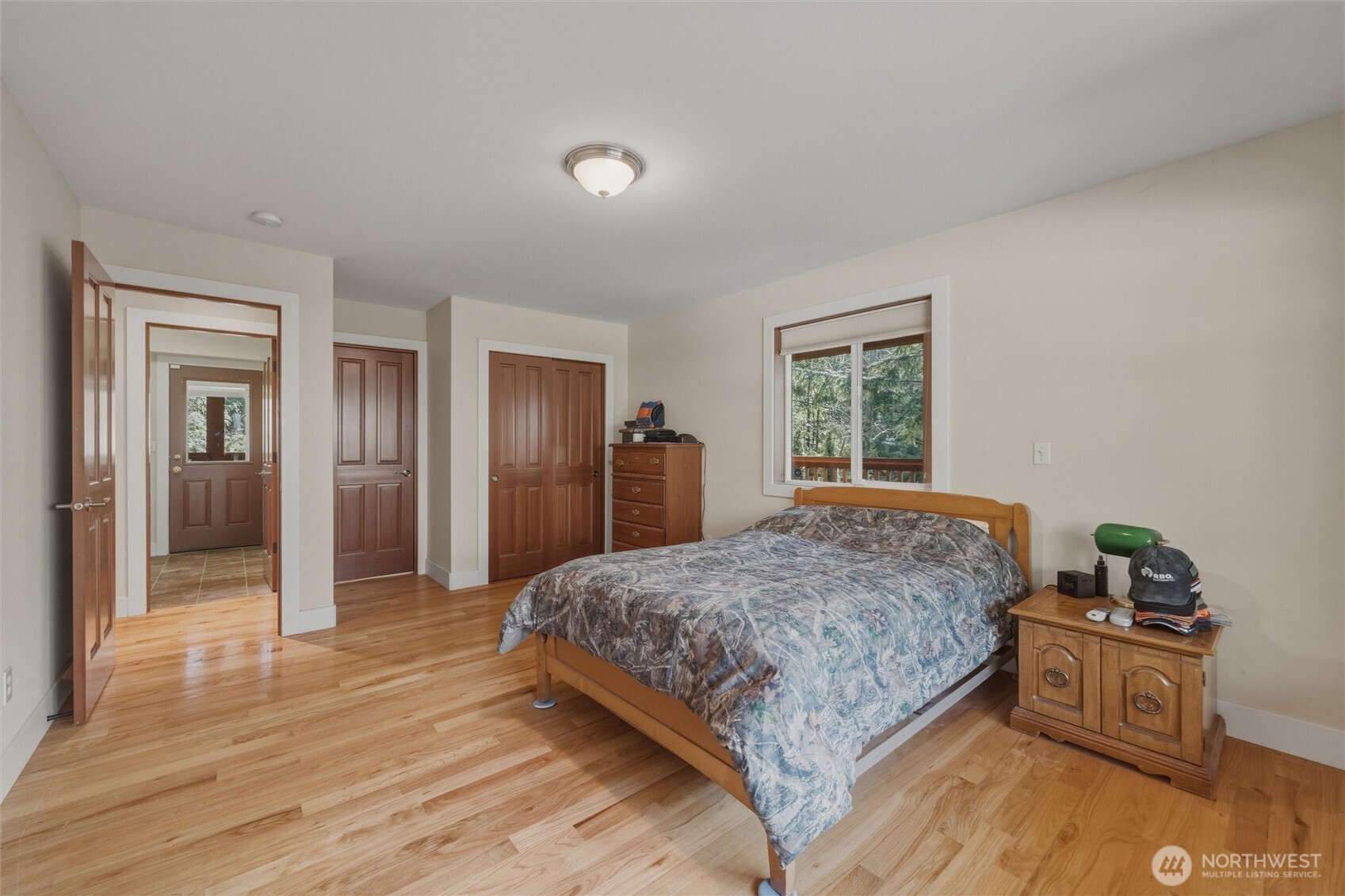 16059 Snee Oosh Road La Conner, WA 98257 - Photo 18 of 40 a bedroom with a bed and a dresser