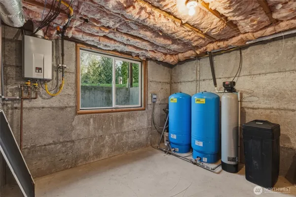 a view of an empty room with wooden walls