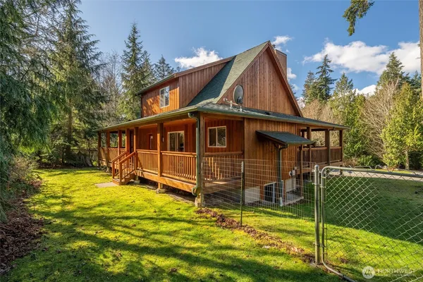a view of balcony with wooden floor and fence