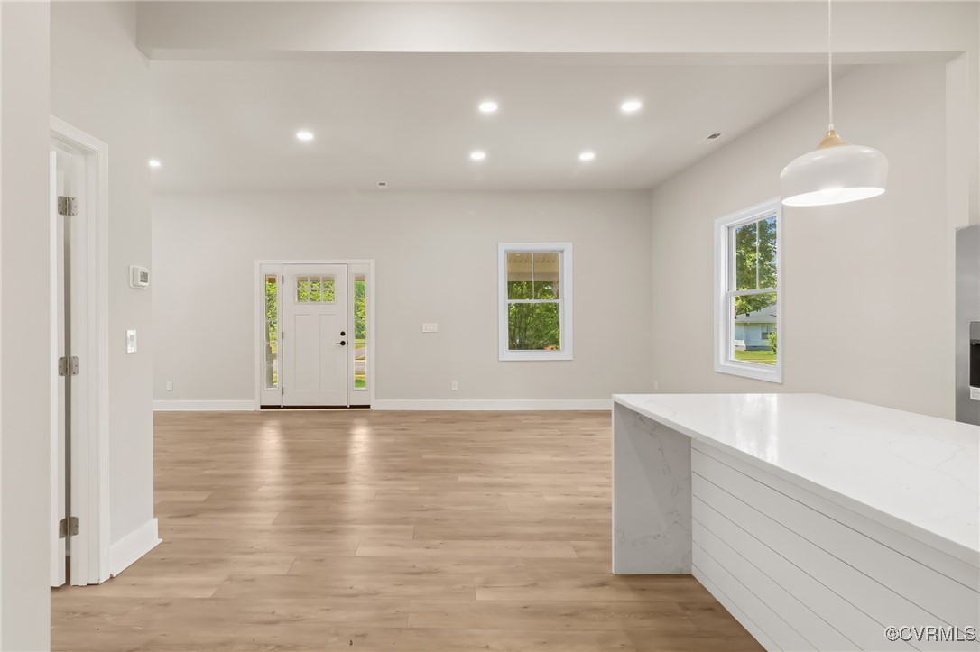 10614 Rives Avenue McKenney, VA 23872 - Photo 13 of 48 a view of an empty room with wooden floor and a window