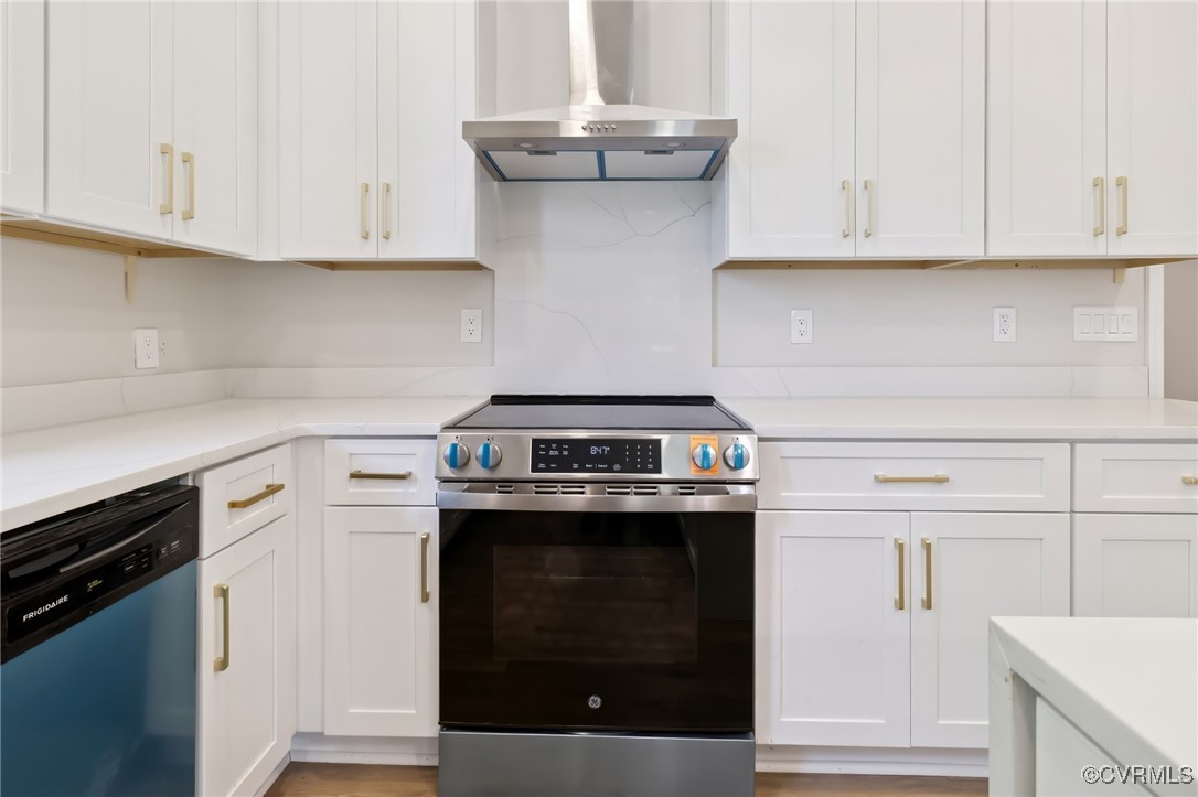 10614 Rives Avenue McKenney, VA 23872 - Photo 14 of 48 a kitchen with stainless steel appliances granite countertop a stove a white cabinet and a granite counter tops