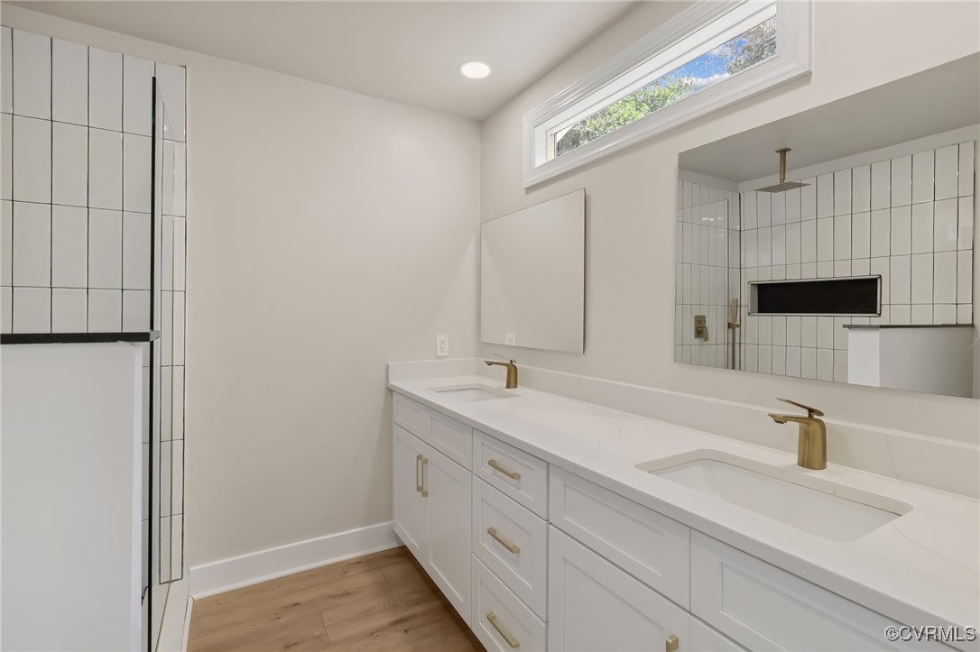 10614 Rives Avenue McKenney, VA 23872 - Photo 20 of 48 a bathroom with 2 sink and a mirror