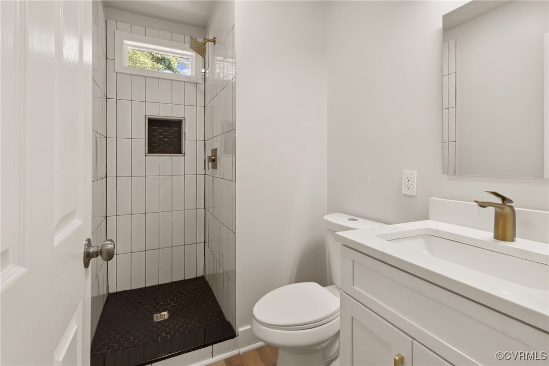 10614 Rives Avenue McKenney, VA 23872 - Photo 27 of 48 a bathroom with a toilet sink and mirror