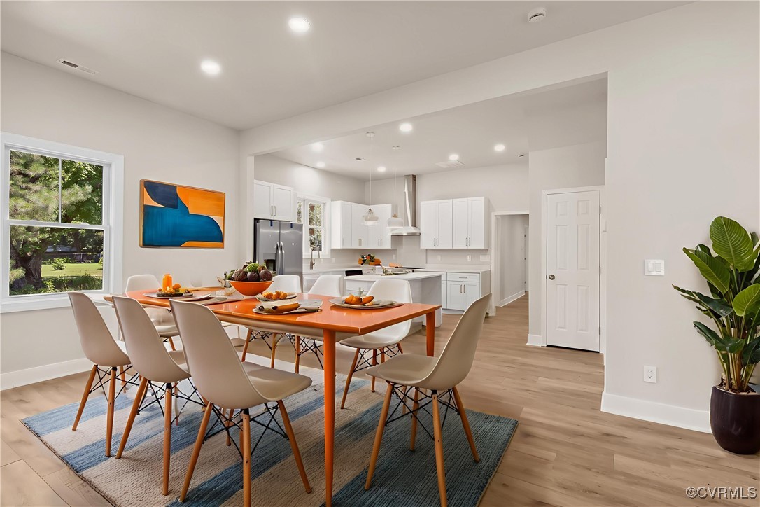10614 Rives Avenue McKenney, VA 23872 - Photo 3 of 48 a view of a dining room with furniture and wooden floor