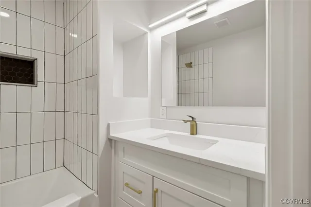 a bathroom with a sink and a shower