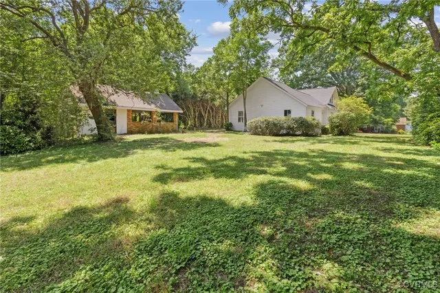 a house view with a garden space