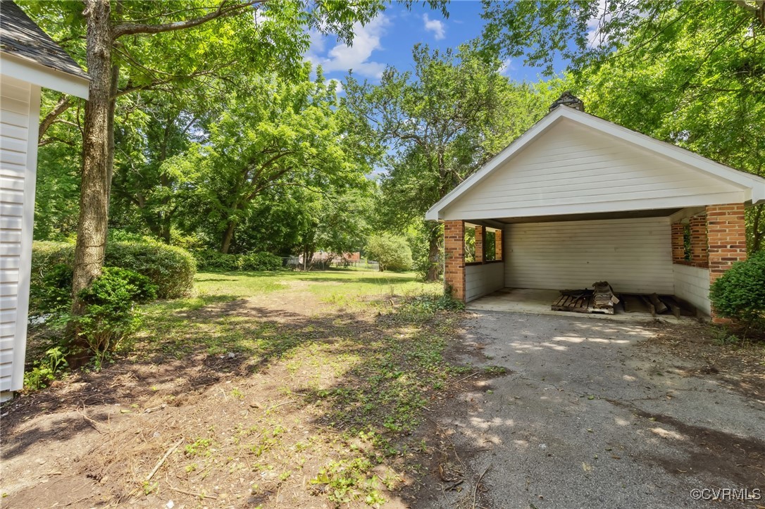 10614 Rives Avenue McKenney, VA 23872 - Photo 46 of 48 a view of a house with yard and a garden