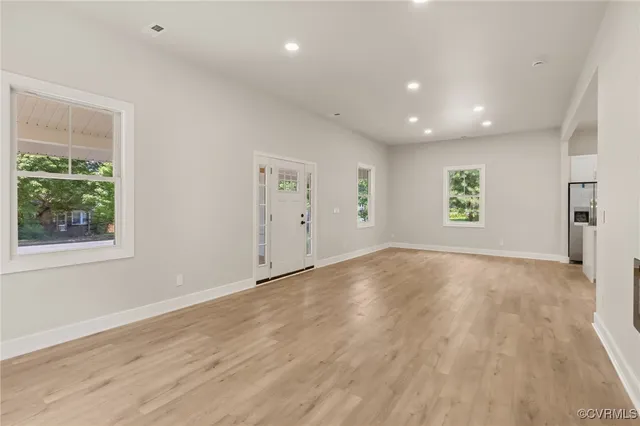 a view of an empty room with a window