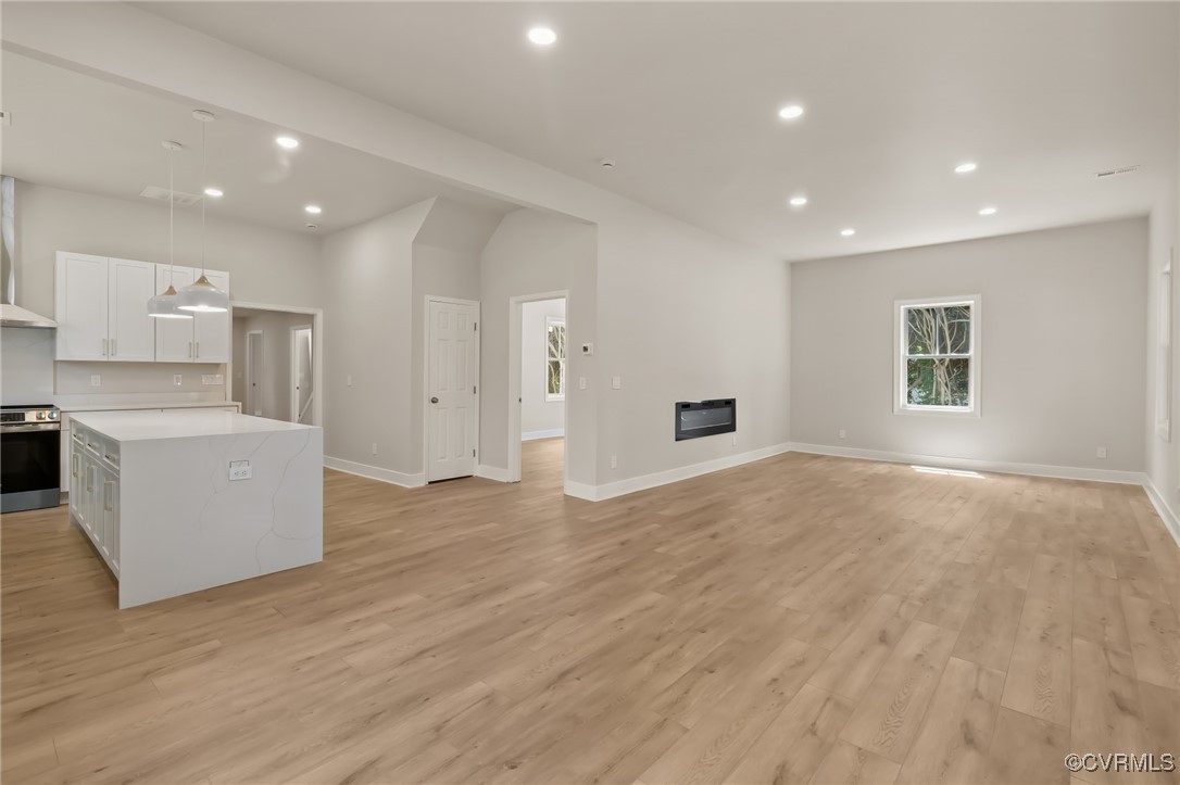 10614 Rives Avenue McKenney, VA 23872 - Photo 10 of 48 a view of a kitchen with furniture and wooden floor