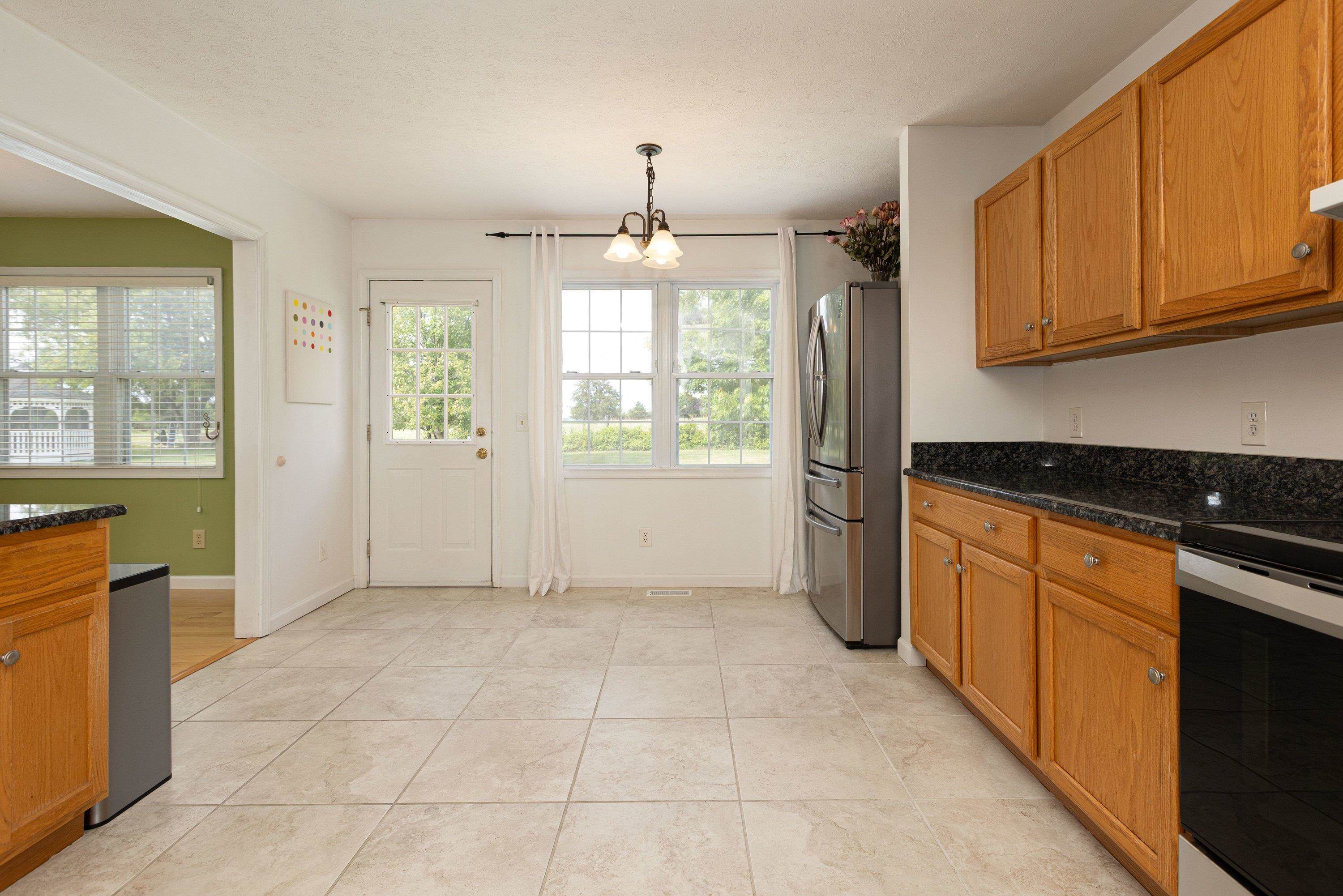 536 Three Leagues Road McGaheysville, VA 22840 - Photo 14 of 71 a kitchen with stainless steel appliances granite countertop a refrigerator and a stove top oven