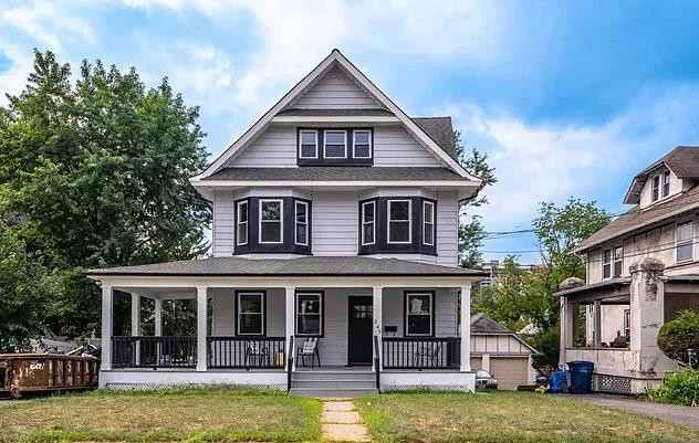 a view of a house with swimming pool and a porch