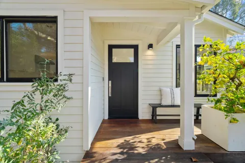 a front view of a house with a porch