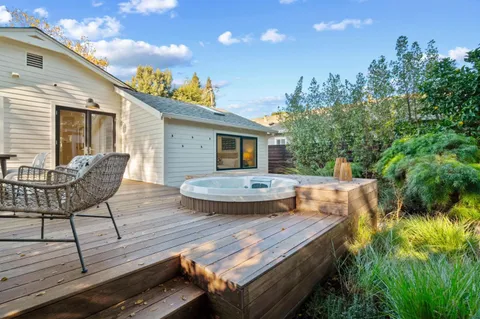 a front view of a house with a yard table and chairs