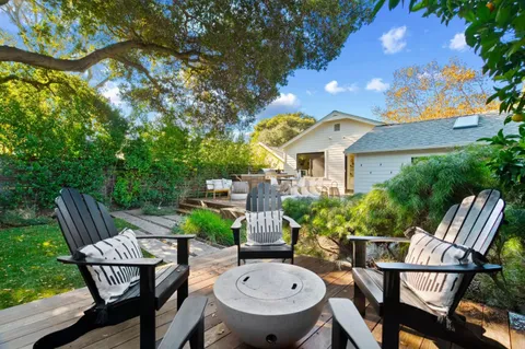 a dining room with a table and chairs