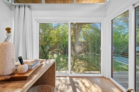 a view of front door of house with stairs