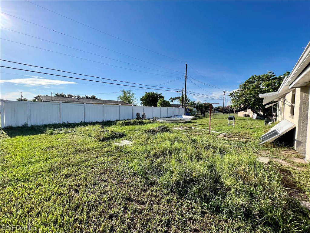 24 Alabama Road South Lehigh Acres, FL 33936 - Photo 17 of 17 a view of a backyard with plants