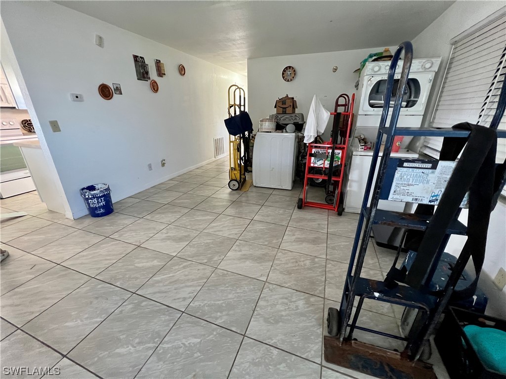 24 Alabama Road South Lehigh Acres, FL 33936 - Photo 4 of 17 a view of a storage & utility room