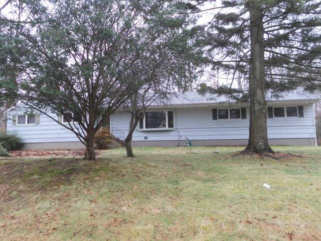 5 Jennifer Road Norwalk, CT 06850 - Photo 1 of 1 a house with trees in front of it