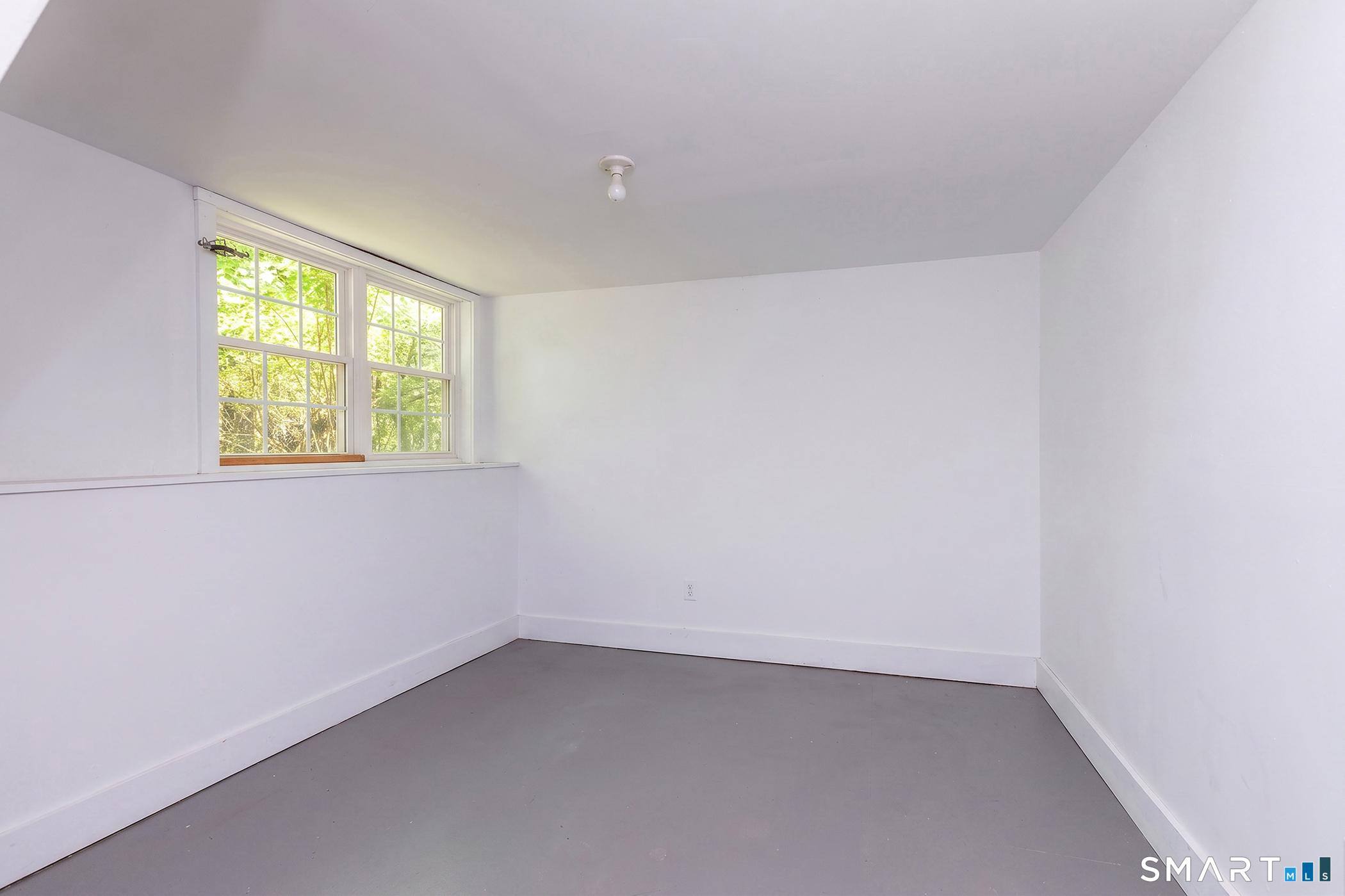 25 Bald Hill Road Kent, CT 06785 - Photo 26 of 38 Flooded with natural light, this dry, partially finished basement offers a pristine blank canvas ready to become your ultimate media room or private exercise studio.