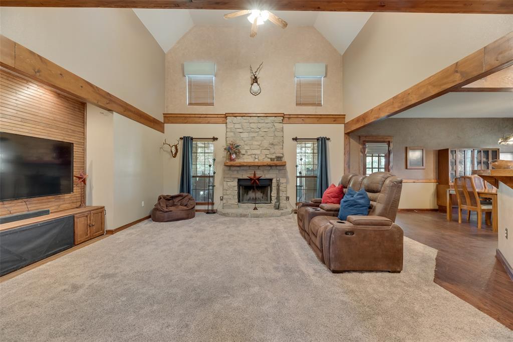 82 Trail Ridge Drive Melissa, TX 75454 - Photo 4 of 29 Stone fireplace (wood burning) enhances the living room