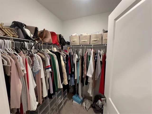 a bedroom with a bed and a television