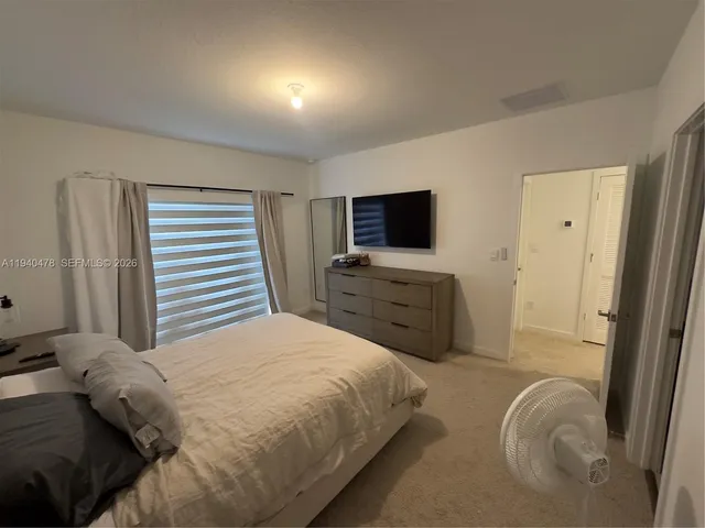 a bedroom with a bed and furniture