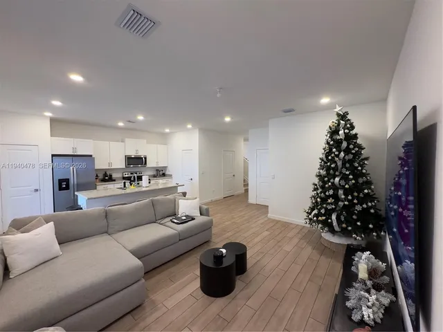a living room with furniture and a rug