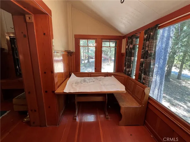 a view of a balcony with a table and chairs