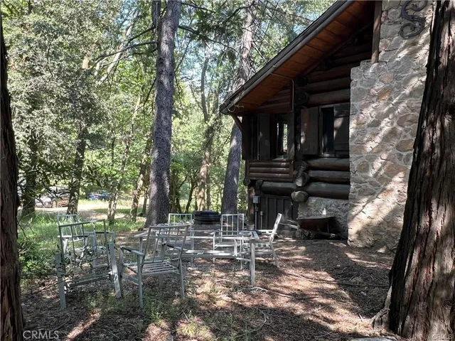 a view of house with a trees in the background