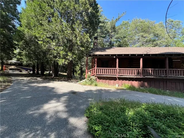 a view of a street with a small yard