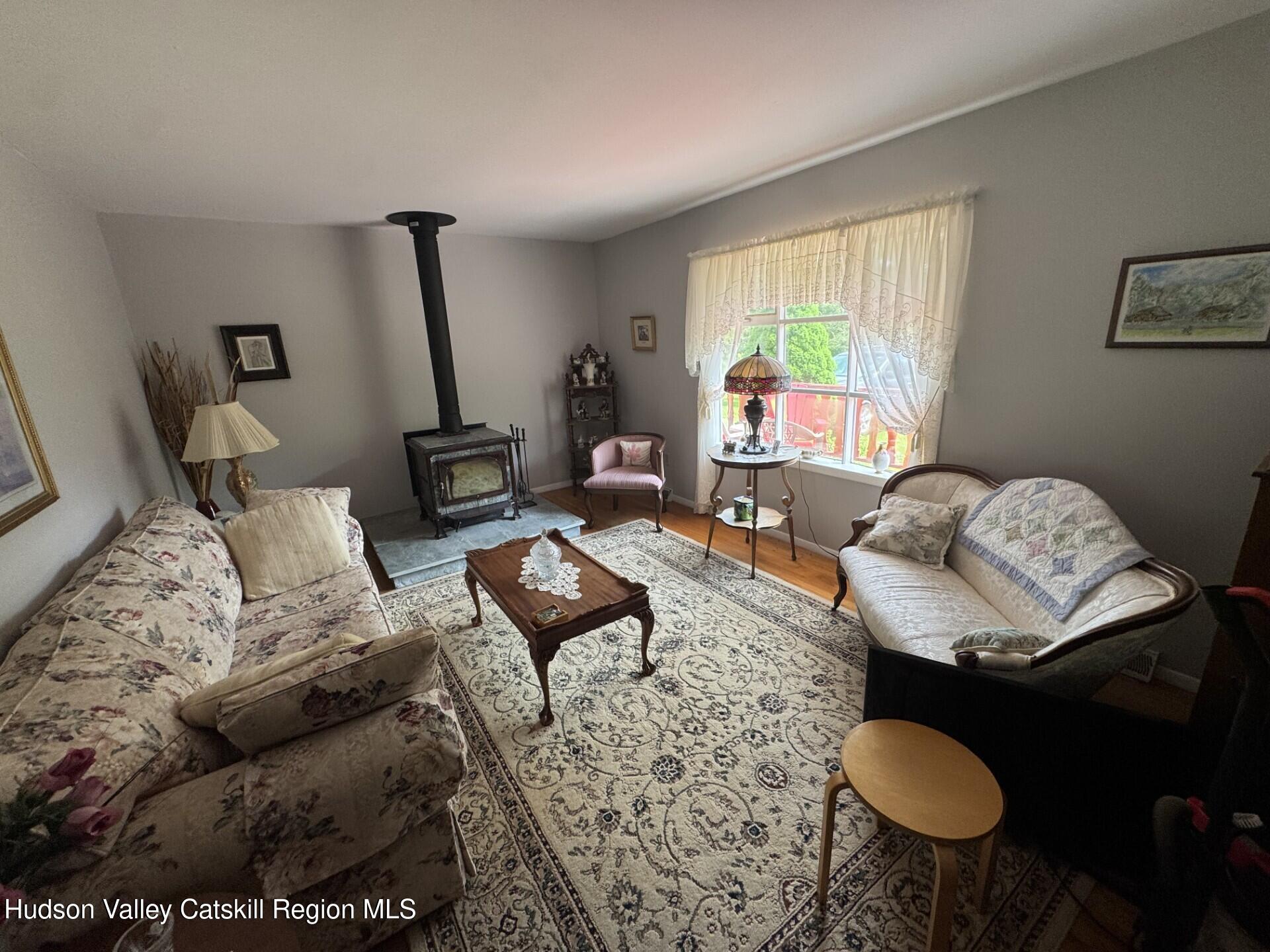 20 Slater Road Windham, NY 12454 - Photo 11 of 47 a living room with furniture and a large window