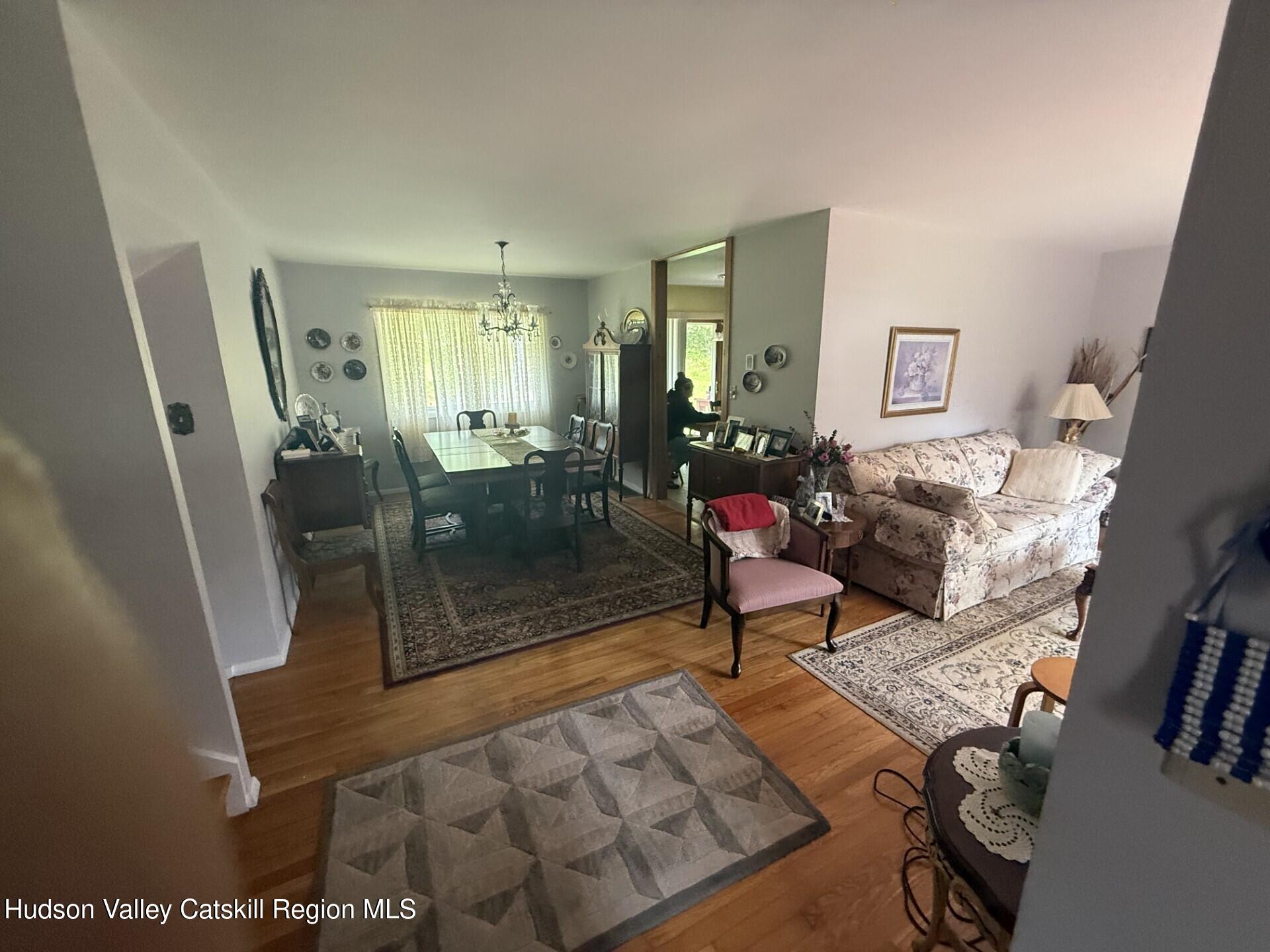 20 Slater Road Windham, NY 12454 - Photo 12 of 47 a living room with furniture and a floor to ceiling window