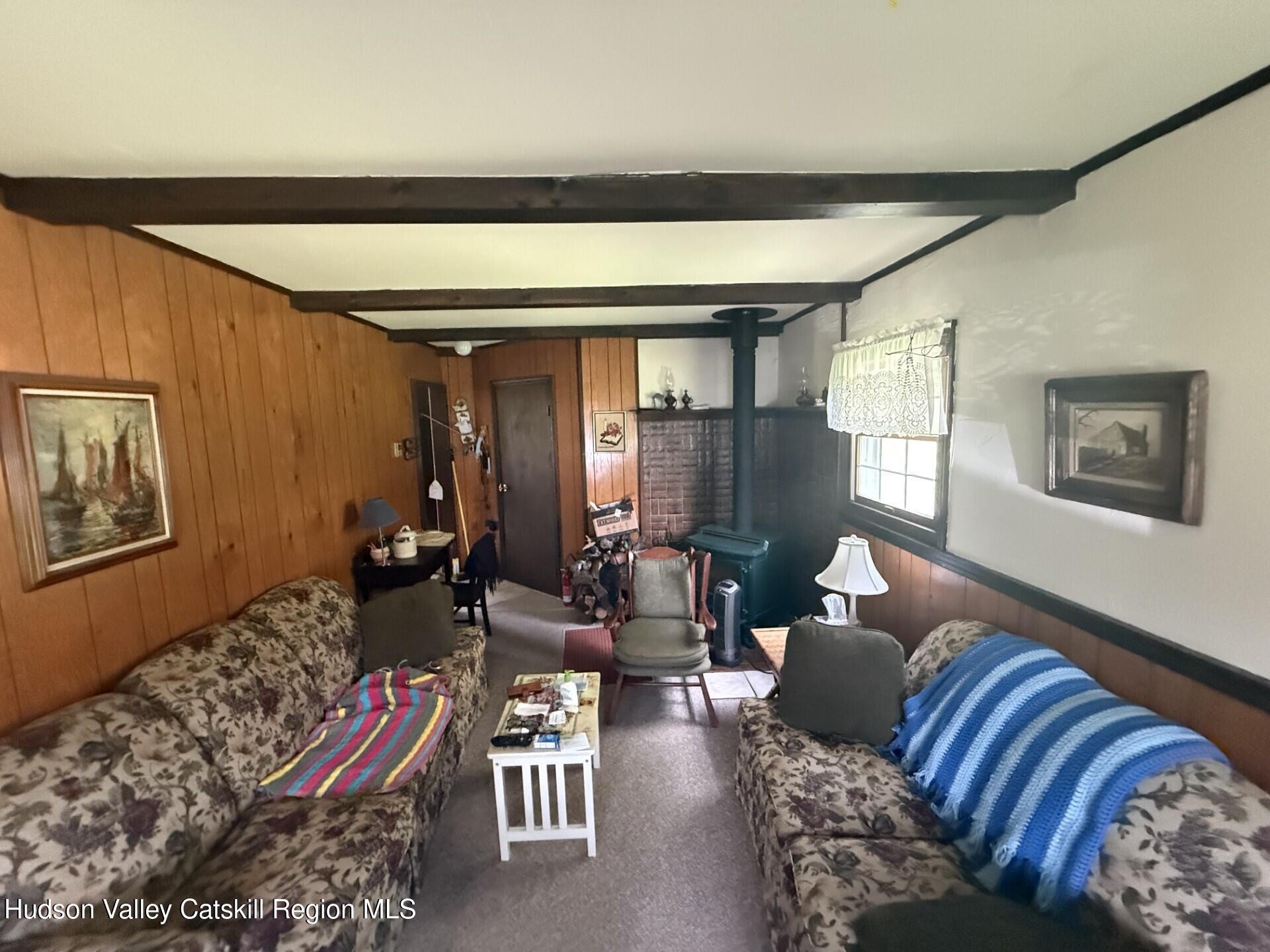 20 Slater Road Windham, NY 12454 - Photo 15 of 47 a living room with furniture and a window