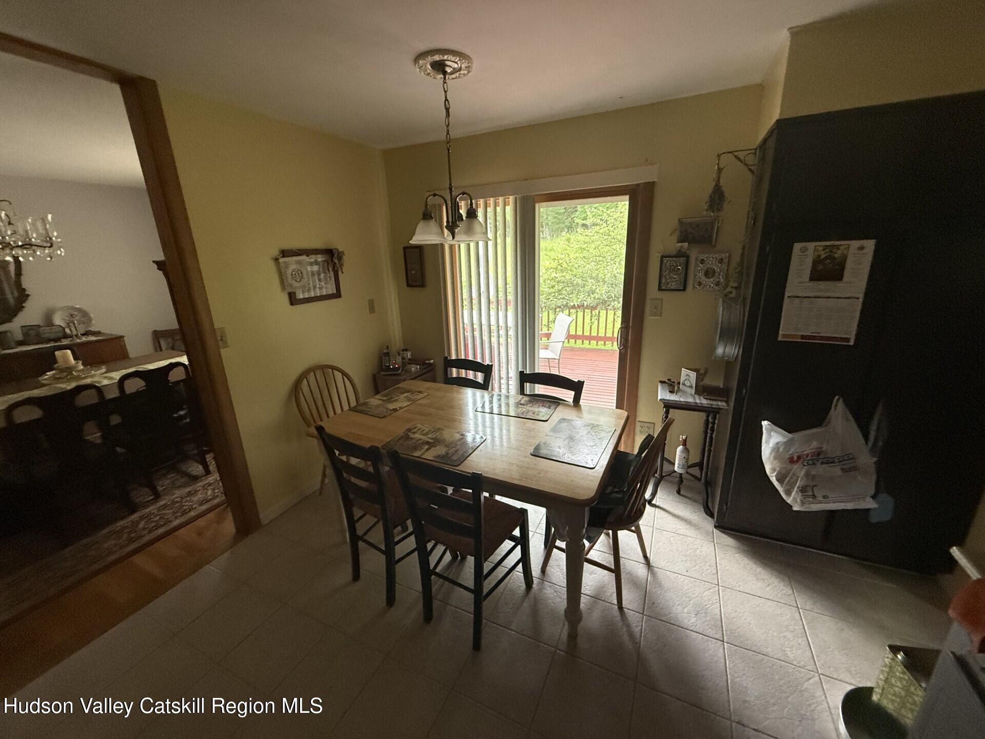 20 Slater Road Windham, NY 12454 - Photo 18 of 47 a view of a dining room with furniture and window