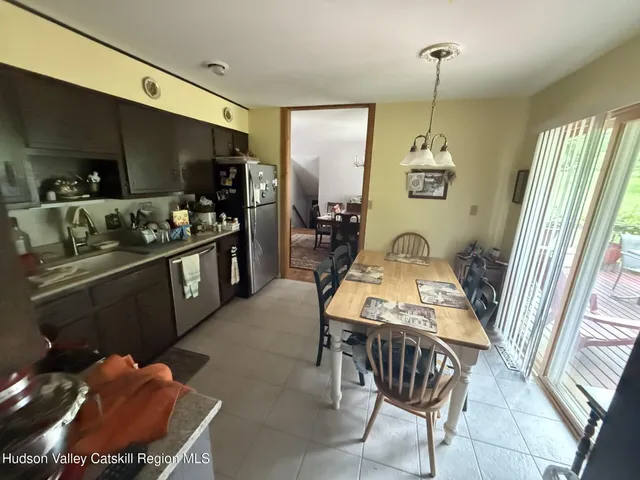 a view of balcony with furniture and garden