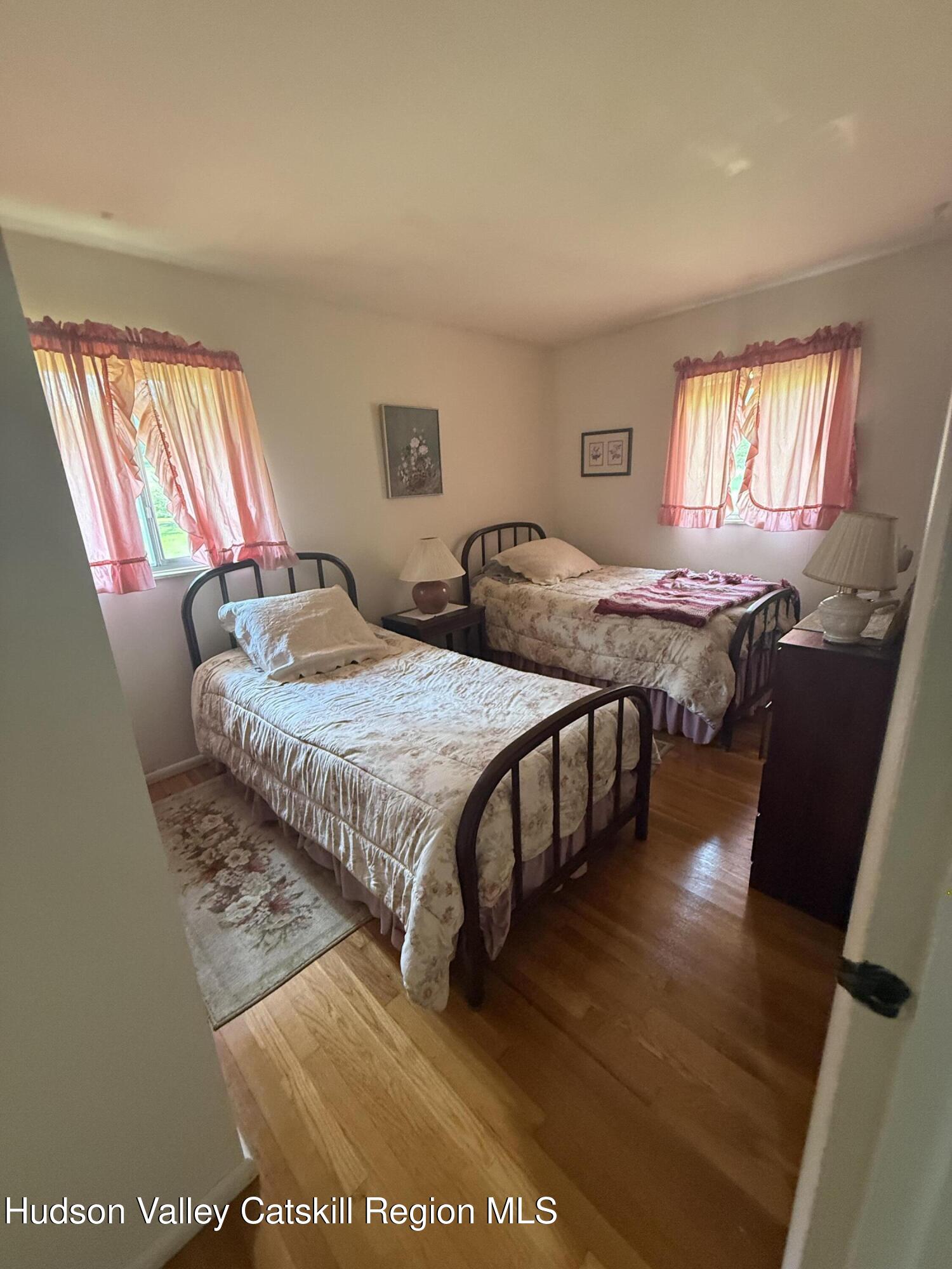 20 Slater Road Windham, NY 12454 - Photo 32 of 47 a bedroom with a bed and a dresser next to a window