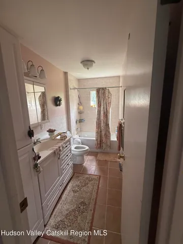 a view of a bathroom from a hallway