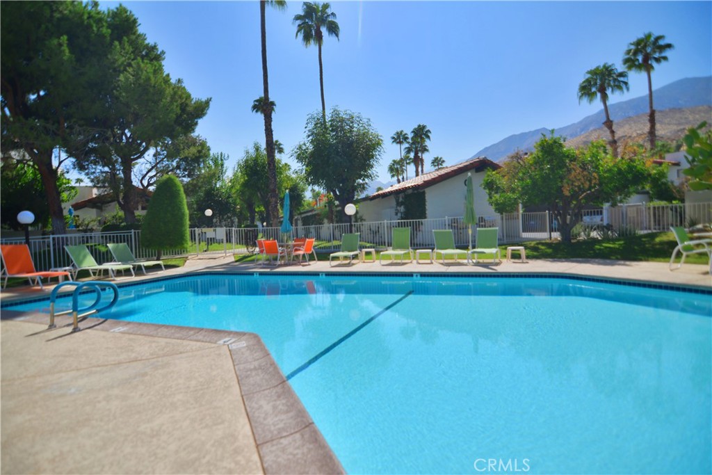 250 East San Jose Road, Unit 63 Palm Springs, CA 92264 - Photo 16 of 22 a view of swimming pool with chairs