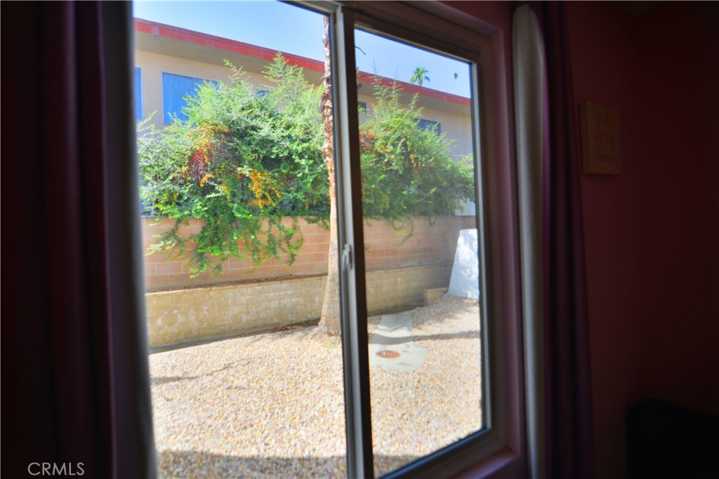 250 East San Jose Road, Unit 63 Palm Springs, CA 92264 - Photo 19 of 22 a view of a glass door with a from balcony