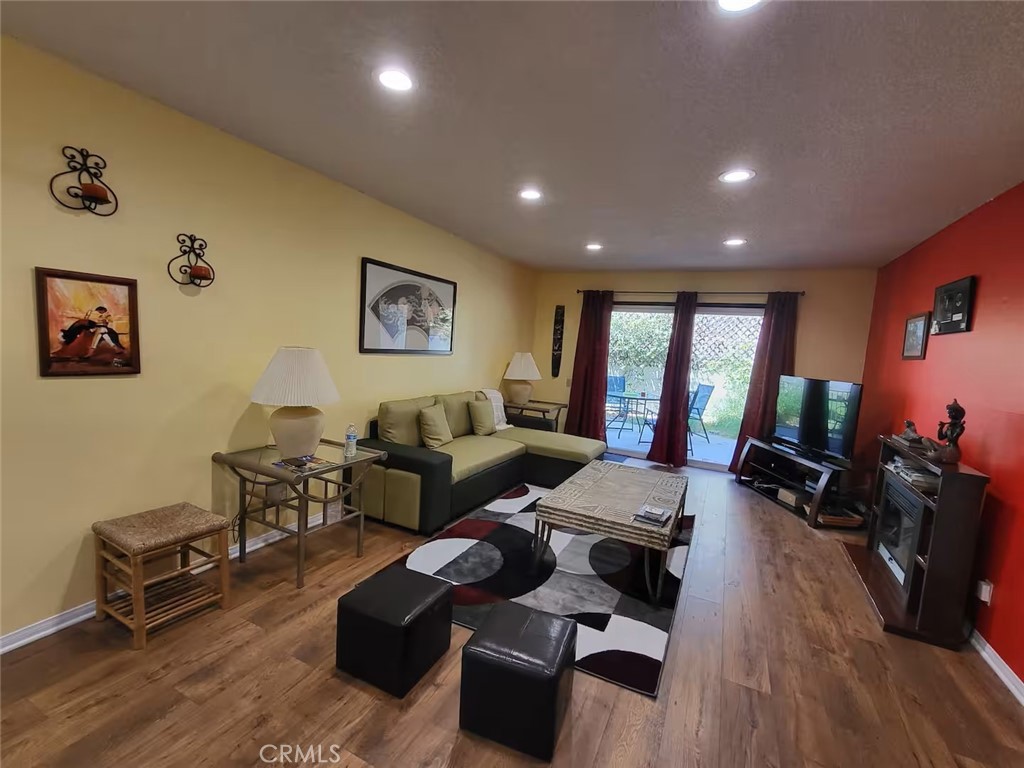 250 East San Jose Road, Unit 63 Palm Springs, CA 92264 - Photo 3 of 22 a living room with furniture and a wooden floor